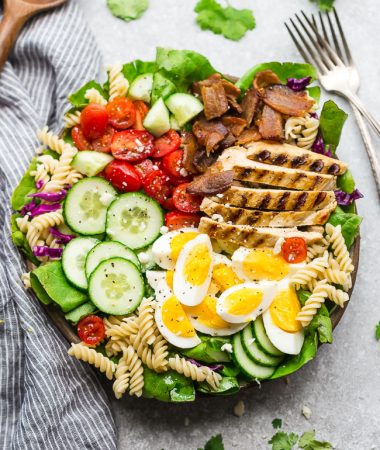 Cobb Pasta Salad - an easy side dish perfect for summer parties, picnics, potlucks and BBQ's. Made with bacon, cucumbers, grilled chicken, tomatoes, hard-boiled eggs, cheese, and a homemade ranch dressing.