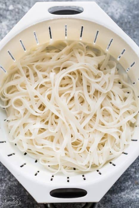 Top view of rice noodles in a white colander