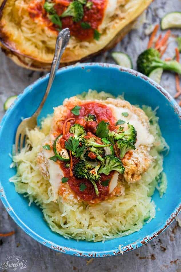 Chicken Parmesan Spaghetti Squash Bowls make the perfect easy one pan meal. Best of all, it's so easy to customize with your favorite veggies and takes just 15 minutes of prep time!