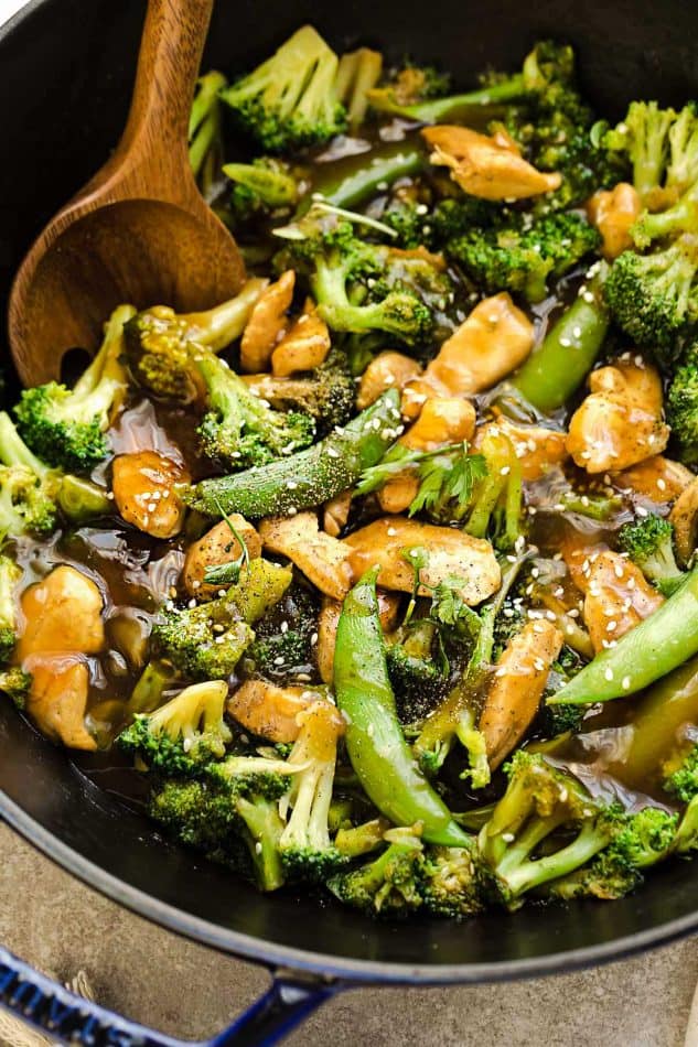 Close-up of Chicken Stir Fry with Broccoli and Snap Peas in a skillet