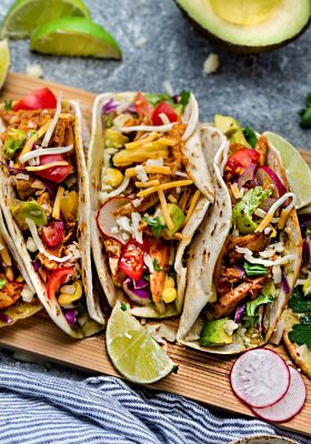 Instant Pot Chicken Tacos come together in under 30 minutes in your pressure cooker for the perfect weeknight meal! Cooks up tender, juicy and full of flavor with a homemade Tex Mex taco seasoning and fire roasted tomatoes. Best of all, low carb, keto & paleo friendly options.