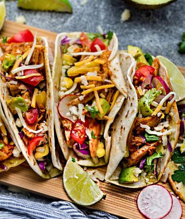 Instant Pot Chicken Tacos come together in under 30 minutes in your pressure cooker for the perfect weeknight meal! Cooks up tender, juicy and full of flavor with a homemade Tex Mex taco seasoning and fire roasted tomatoes. Best of all, low carb, keto & paleo friendly options.