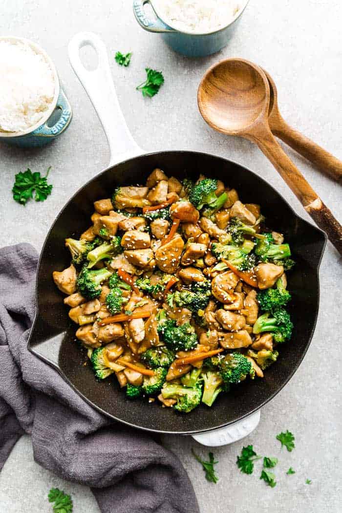 Delicious Chicken and Broccoli Stir-Fry in a white and black skillet.