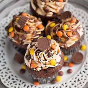 Four Reese's Peanut Butter Cup Chocolate Cupcakes on a plate