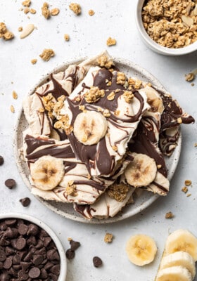 Overhead shot of a stack of banana nut yogurt bark in a white bowl