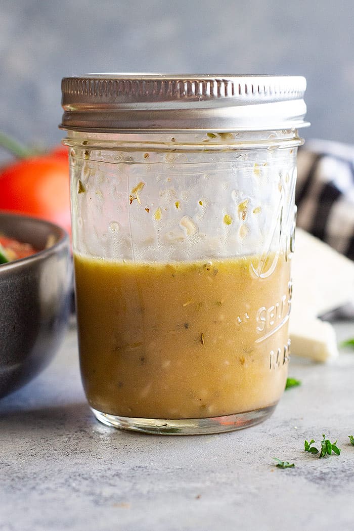 A small jar of homemade Greek salad dressing