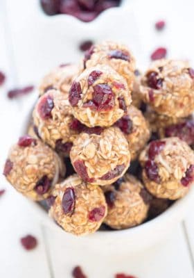 No Bake Cranberry Coconut Energy Bites make the perfect healthy gluten free snack on the go and are so easy to make and customize. Best of all, they make a great vegan, gluten free snack option with NO added REFINED sugar. Great for Sunday meal prep for adding to back to school or work lunchboxes.