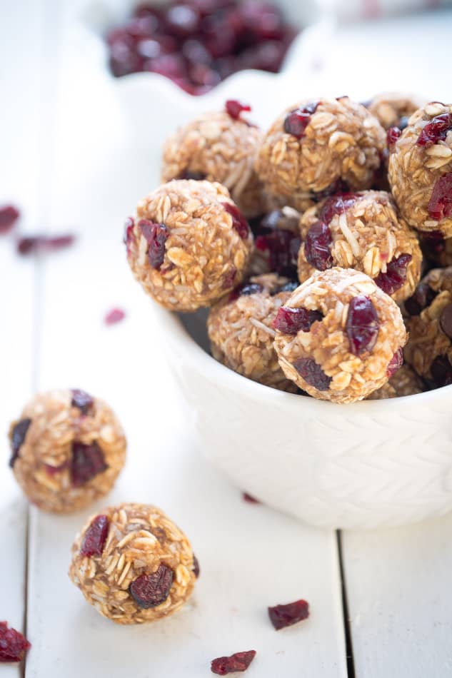 No Bake Cranberry Coconut Energy Bites make the perfect healthy gluten free snack on the go and are so easy to make and customize. Best of all, they make a great vegan, gluten free snack option with NO added REFINED sugar. Great for Sunday meal prep for adding to back to school or work lunchboxes.