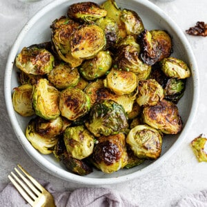 Top view of cooked Brussels sprouts in a white bowl