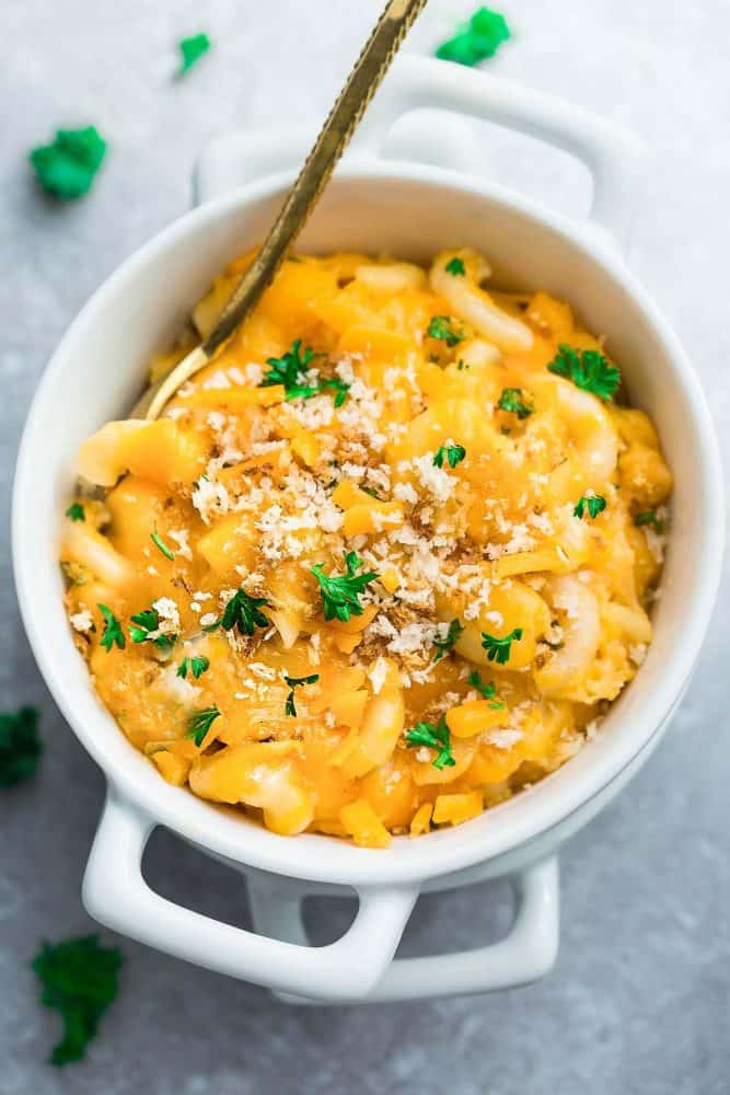 A Small White Crock Containing Creamy Homemade Macaroni and Cheese