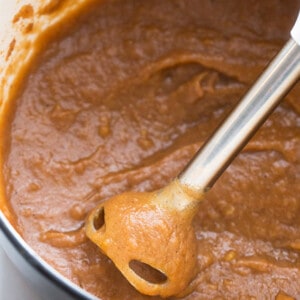 Crock Pot Apple Butter being purred with an immersion blender
