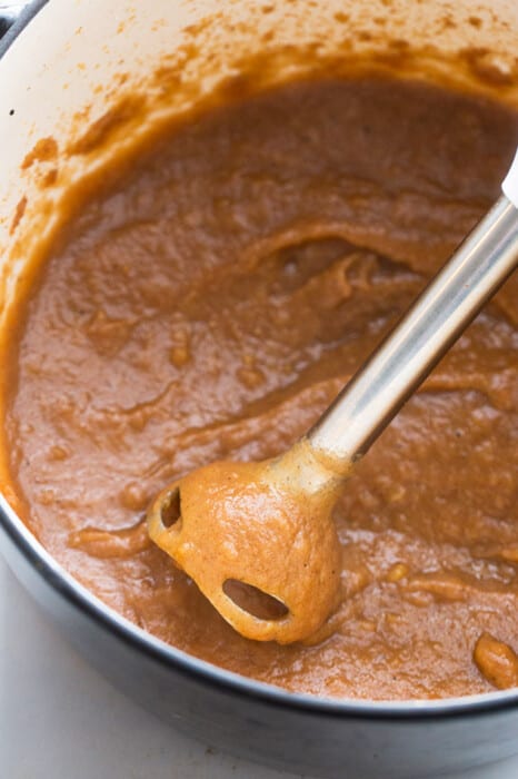 Crock Pot Apple Butter being purred with an immersion blender