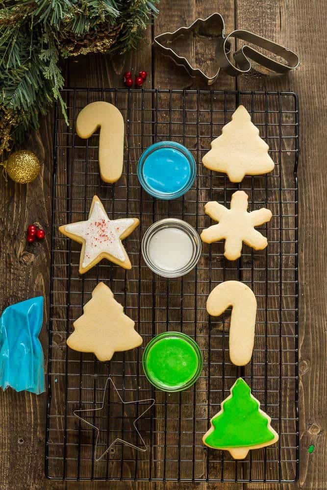 The BEST sugar cookie recipe for making decorated cut out Christmas / holiday shapes with perfect edges. Best of all, these delicious cookies bake up soft, flavorful and are easy to make with a just a few pantry ingredients. Plus instructions on how to decorate with royal icing and tips on how to make amazing cookies that don't spread. Perfect for Santa's cookie tray or holiday parties. 