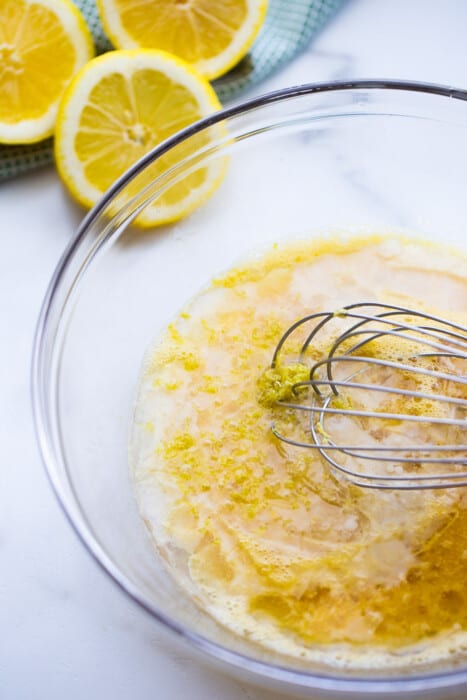 A bowl of wet ingredients for the vegan lemon loaf batter
