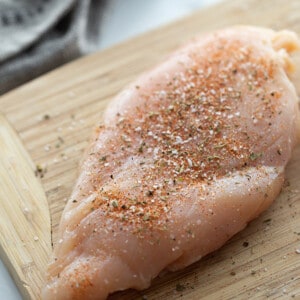 Top view of chicken breast on a cutting board