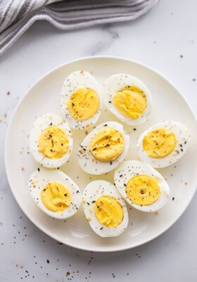 A Plate of Air Fryer Hard Boiled Eggs on a Gray Marble Countertop