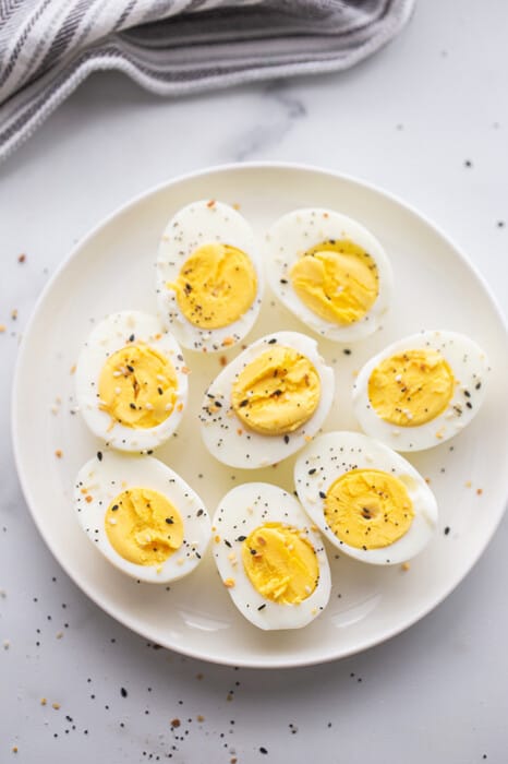 A Plate of Air Fryer Hard Boiled Eggs on a Gray Marble Countertop