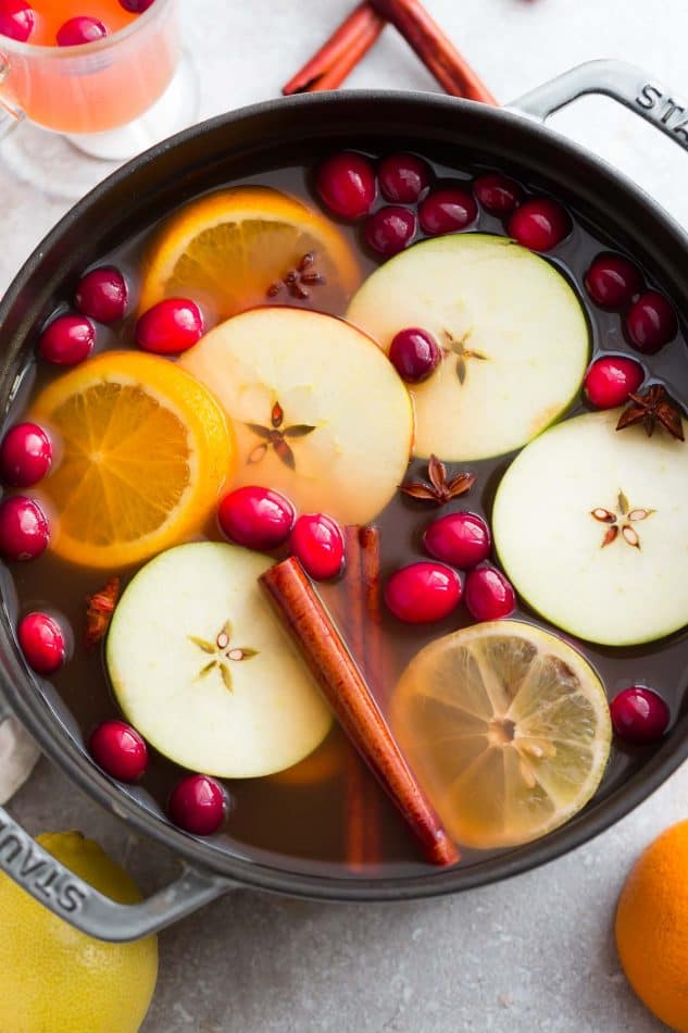 This Easy Homemade Apple Cider Recipe is the perfect easy drink for fall and the holiday season. Best of all, this easy version is made with a blend of juices and infused with apples, orange, lemon, cranberries, cinnamon and cloves. Set and forget and makes your house smell amazing! Warm up with a mug by a cozy fireplace.