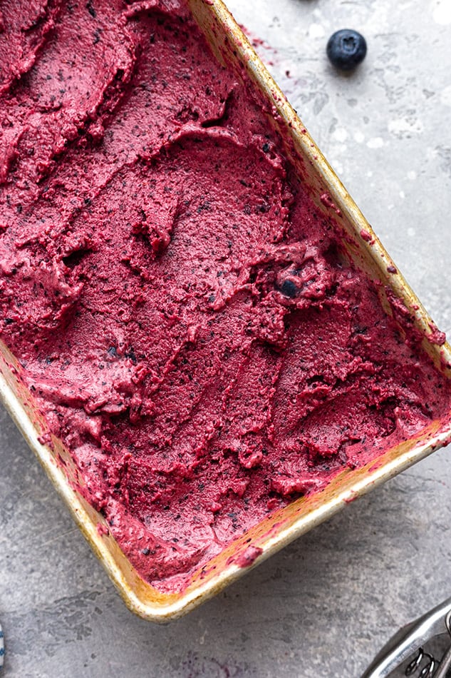 Close-up overhead view of homemade blueberry ice cream in a loaf pan