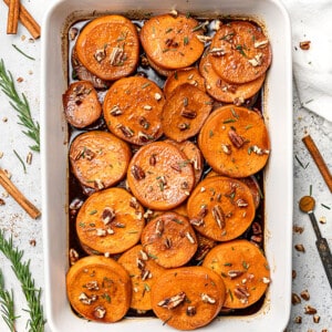 Overhead view of candied sweet potatoes in a baking dish