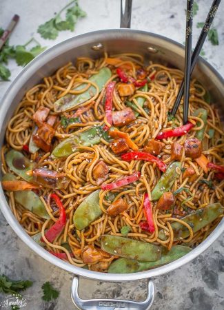 Chicken Lo Mein in a skillet with chopsticks