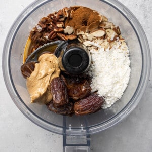 Ingredients to make peanut butter energy balls in a food processor