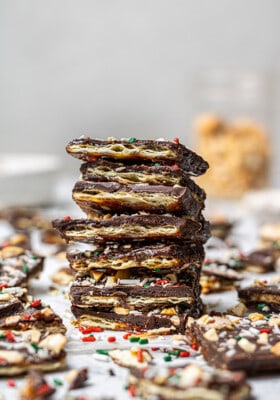 Side shot of a stack of 7 holiday christmas toffee cracker