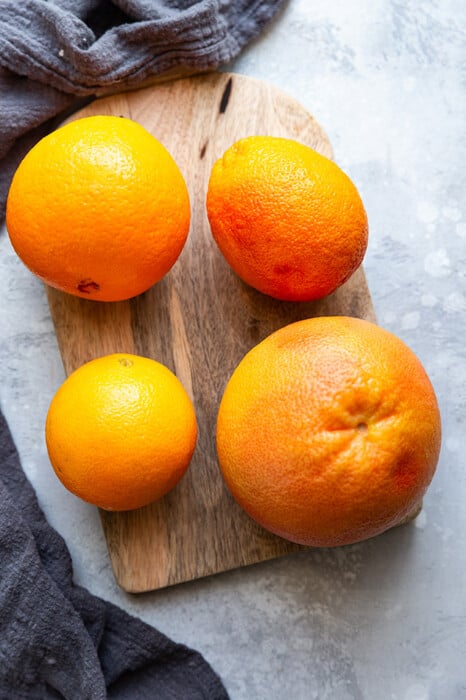 Top view of a grapefruit, blood orange, cara cara orange and navel orange