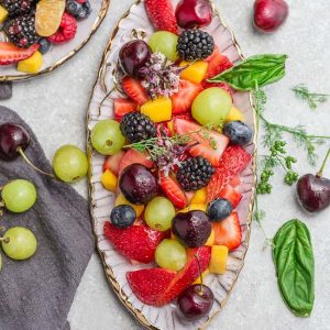 Top view of classic fruit salad in an oval platter