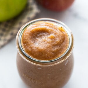 Top side view of easy apple butter in a glass jar