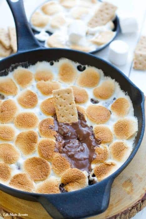 Pan of S'mores dip with graham cracker and chocolate