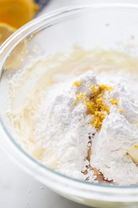 A bowl of ingredients to make the cream cheese frosting for the lemon cake