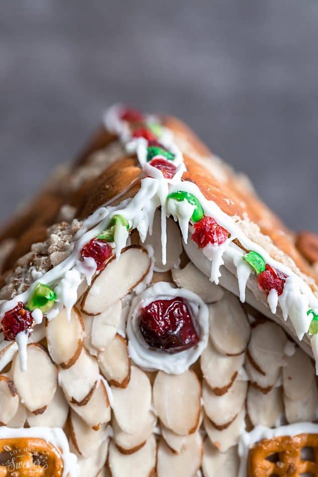 An easy and simple way to make a "gingerbread" house using graham crackers and nuts. It's the perfect holiday activity for the kids and best of all, no baking required!