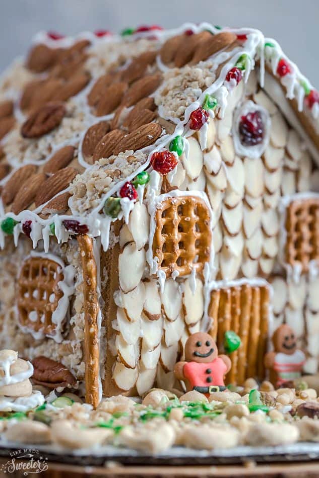 An easy and simple way to make a "gingerbread" house using graham crackers and nuts. It's the perfect holiday activity for the kids and best of all, no baking required!