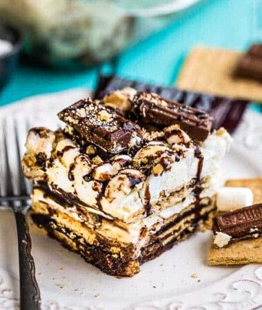 A square of No Bake S'mores Icebox Cake on a plate with a fork