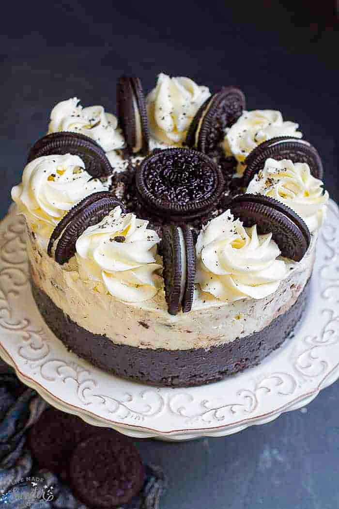 Front view of Oreo ice cream cake on white plate.