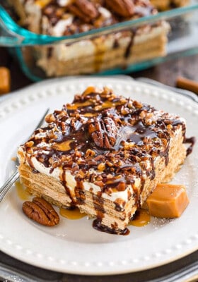 Side view of a square of Peanut Butter Icebox Cake on a white plate