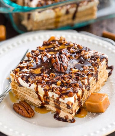 Side view of a square of Peanut Butter Icebox Cake on a white plate