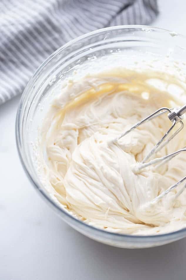 Top view of cream cheese frosting in a mixing bowl