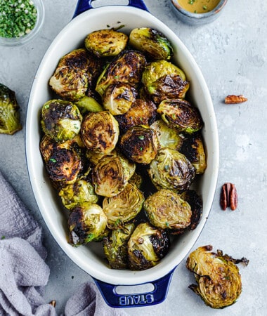 Top view of cooked Brussels sprouts in an oval casserole dish