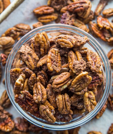 Top view of easy roasted pecans in a clear bowl