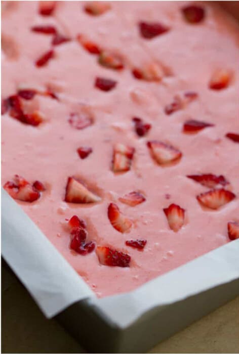Top view of unbaked strawberry cake batter in a rectangle cake pan