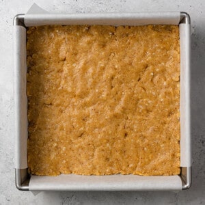 Shortbread crust for strawberry pie bars in a square baking pan
