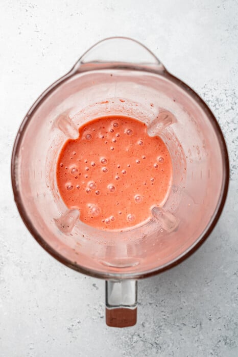 Top view of blended strawberry dressing in a blendet