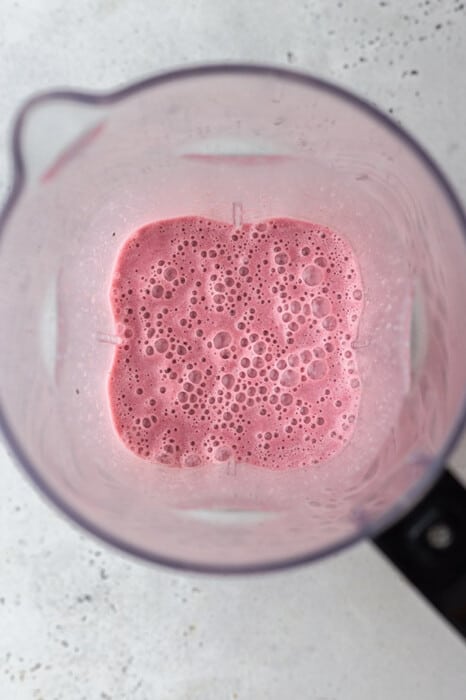 Blended strawberries and milk in a blender