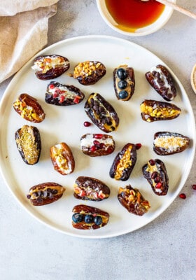 Top view of stuffed dates on a white plate