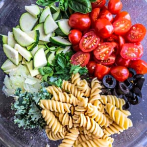 Top view of Summer Pasta Salad ingredients in a mixing bowl