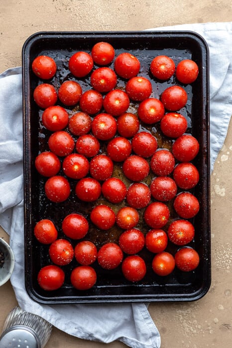 Top view of cherry tomatoes on a baking sheet