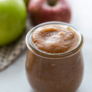Side view of homemade apple butter in a glass jar