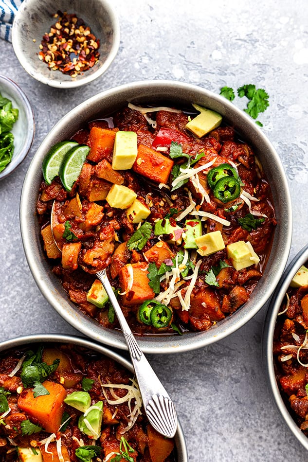 Overhead view of a few bowls of vegan chili